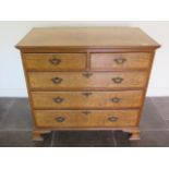 A 19th century walnut veneered five drawer chest with a quarter veneered top on shaped bracket feet,