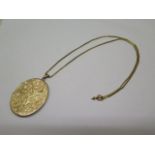 A hallmarked oval 9 ct gold Locket on a 9 ct chain marked 9c , total weight approx 26 gs , locket 5