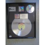 A Madonna, Like a Prayer Platinum Disc Sales Award, presented to Sire Records, 54cm x 43cm, in