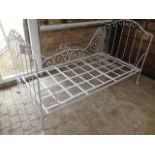 A 20th century ornate wrought iron folding campaign bed, 109cm tall x 100cm wide x 188cm long,