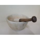 A pestle and mortar, 13cm tall x 26cm diameter, in generally good condition, some marks consistent