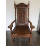 A well carved oak throne armchair, 135cm tall x 73cm wide x 62cm deep