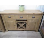 A good quality oak sideboard with a wine rack, 150cm wide x 90cm tall, new ex-display, retails at £