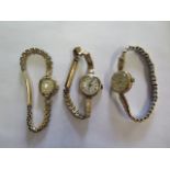 Three 9ct yellow gold manual wind ladies watches all on plated straps and all not working, total