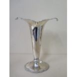 A silver vase with weighted base, Birmingham 1913/14, Elkington & Co, 22cm tall, some small