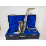 A Boosey and Hawkes saxaphone with hard case