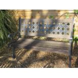 A weathered Berkeley Forge cast iron wooden slatted bench, 126cm wide