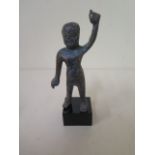 A metal figure on stand with aged patinated finish, 11cm tall