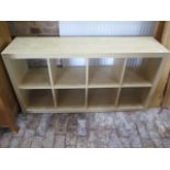 A wood effect shelf unit, 79cm x 150cm x 39cm