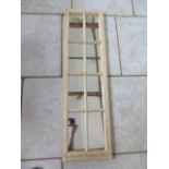 A pine window mirror, 128cm x 36cm