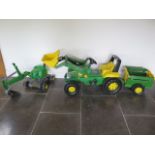 A John Deere plastic pedal tractor with trailer and digger