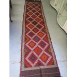 A hand knotted woollen old Sozni Kilim runner, 292cm x 70cm