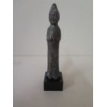 A metal figure on stand with aged patinated finish, 13cm tall