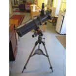 A Celetron Astro Master 130 telescope on tripod