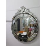 A Venetian style etched mirror, 73cm x 58cm, in good condition, some spotting to mirror