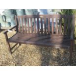 A weathered wooden garden bench, 152cm wide