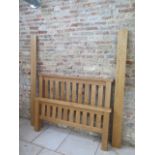 A good quality oak bed, 4' 6" wide, complete in good condition with a Sleepezee mattress one small