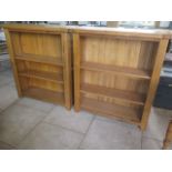 A pair of modern oak bookcases with adjustable shelving, 111cm tall x 99cm x 32cm