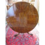 A Victorian walnut tilt top breakfast / dining table on carved tripod base, 72cm tall x 133cm