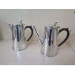 A silver plated coffee pot and water pot in good condition, 18cm tall