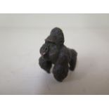 A bronze Gorilla with aged patinated finish, 4cm long