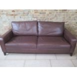 A Multiyork three seater sofa in soft brown leather in good condition, 210cm wide x 97cm deep