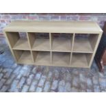A wood effect shelf unit, 77cm x 147cm x 39cm