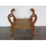 An oak scroll support stool with copper plated stretchers, 70cm tall x 65cm x 36cm, in good