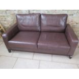 A Multiyork two seater sofa in soft brown leather, in good condition, 178cm x 97cm deep