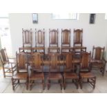 A good quality antique style oak draw leaf refectory style table with 12 high back oak chairs having