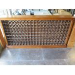 A handmade walnut wine rack holding 190 bottles, 205cm wide x 108cm tall