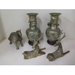 A pair of bronze / brass dragon vases on wooden stands, 29cm tall, a pair of bronze / brass