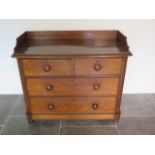 A Victorian mahogany chest / washstand of two over two drawers with galleried top, 90cm tall x 105cm