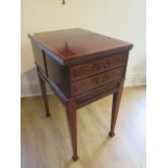 An inlaid mahogany work table with two active drawers and a lift up top on square tapering legs,