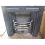 A large Georgian style cast iron fireplace with polished front, 102cm tall x 108cm wide, never