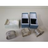 A pair of silver napkin rings and a single napkin ring, total approx 1.4 troy oz, all boxed in