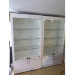 A pair of good quality shop display cabinets with electric lighting and slam shut locks, each