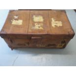 A vintage leather trunk with a brass lock, 36cm tall x 91cm x 52cm, in polished usable condition