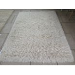 A modern shag pile rug, 170cm x 140cm, by the Real Rug Company, made in India, in good condition