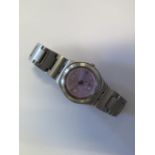 A ladies pink dial and stainless steel Swatch watch, in good condition