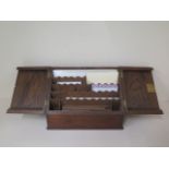A rosewood correspondence box with two sloping doors, 26cm tall x 35cm wide x 19cm, generally good