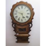 An 8 day drop case walnut American wall clock strikes hours in running order, 80cm tall
