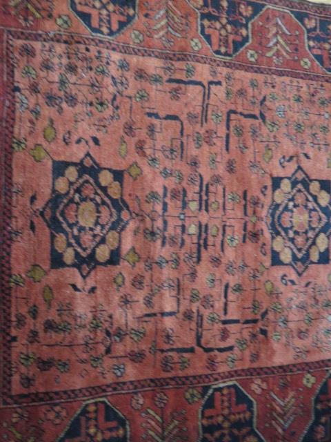 A hand knotted woollen rug, slight wear but generally good, 155cm x 104cm - Image 2 of 3