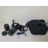 A Canon EOS 1100D digital SLR camera with a Canon zoom lens EF 75-300mm 1:4-5.6111 lens and a