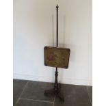 An early Victorian rosewood pole screen with embroided banner in good condition, 142cm tall