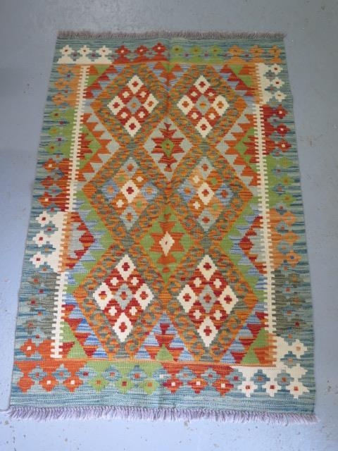 A hand knotted woollen Chobi Kilim rug, 122cm x 83cm