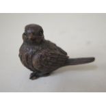 A bronze bird with aged patinated finish, 5cm long