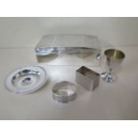 A silver desk box, 17cm wide, a silver Amarda dish, two serviette rings and an inkwell, weighable