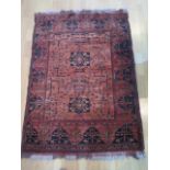 A hand knotted woollen rug, slight wear but generally good, 155cm x 104cm
