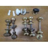 Five Victorian and later brass door handles and two single handles and two key hole covers